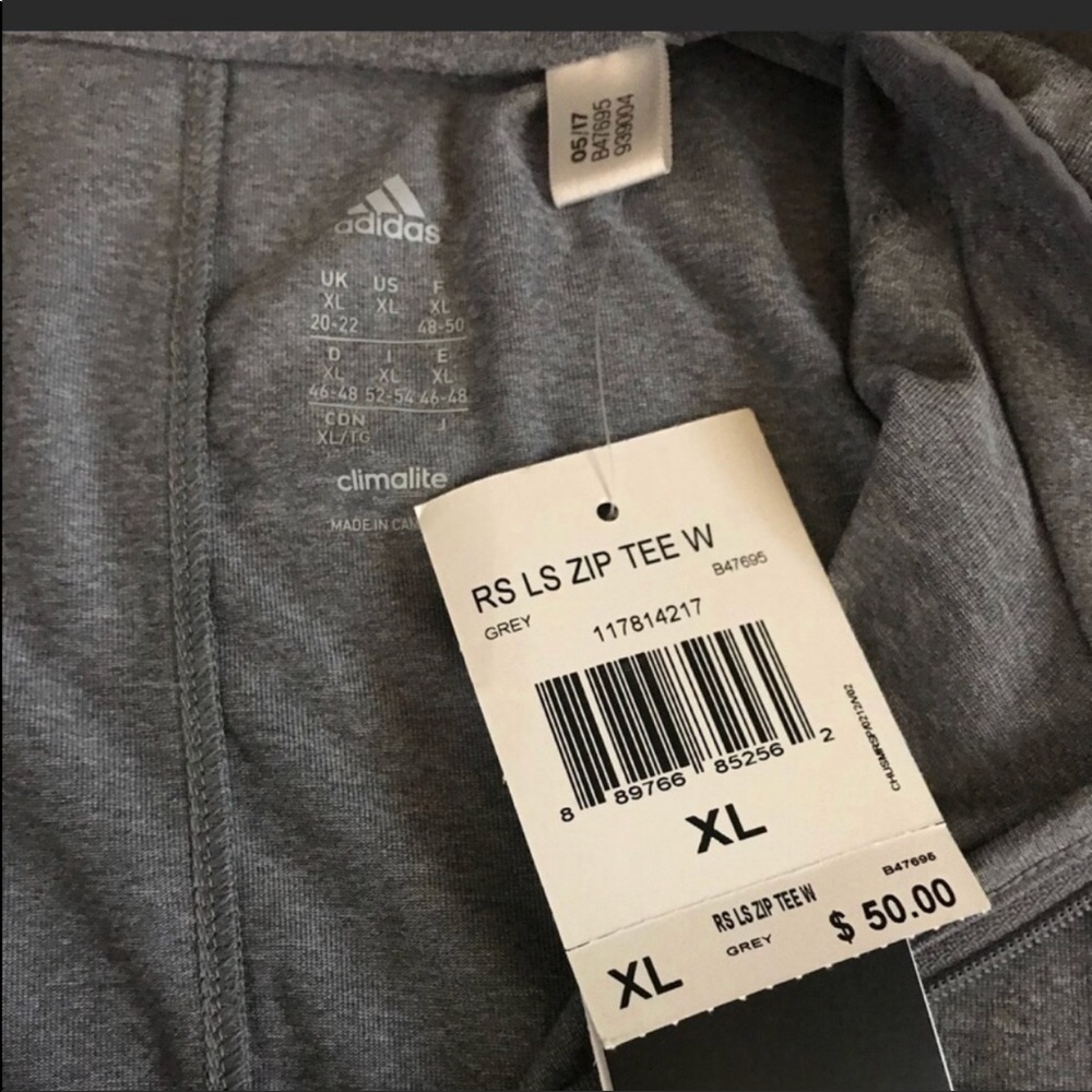 Women’s adidas brand new zip up long sleeve.